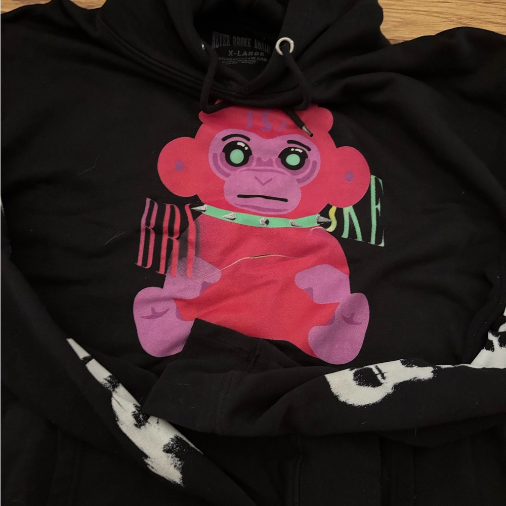 Never Broke Again Black Hoodie with Pink Graphic
New!! - Picture 2 of 3